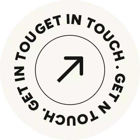 Circular badge with text 'GET IN TOUCH · GET IN TOUCH · GET IN TOUGET' around the border and an arrow pointing diagonally upward in the center
